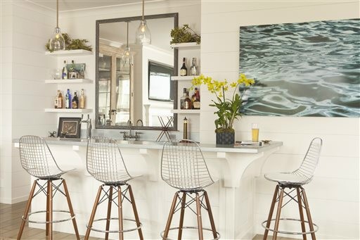 This bar with its beach-inspired design demonstrates how the sun-drenched colors and windswept beachfront textures of summer provide ample inspiration for indoor decorating. With a light touch and careful choices, summer can provide ideas for an interior you'll love all year long.