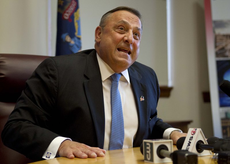 Gov. Paul LePage speaks to reporters shortly after the Maine House and Senate both voted to override his veto of the state budget, Wednesday, June 26, 2013, at the State House in Augusta, Maine. (AP Photo/Robert F. Bukaty)