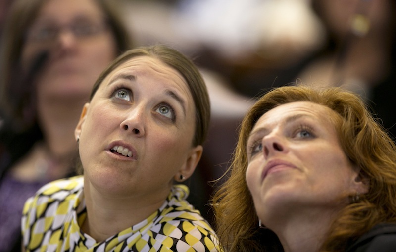 State Reps. Eleanor Espling, R-New Gloucester, left, and Amy Volk, R-Scarborough, look at the tote board during a roll call vote during a session Thursday, June 13, 2013, at the State House in Augusta, Maine. A bill that would provide health insurance to more than 60,0000 low-income Mainers was enacted by the Legislature Thursday, but it’s still three votes short of a veto-proof majority. (AP Photo/Robert F. Bukaty)