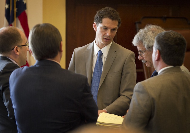 Senate President Justin Alfond, D-Portland, center speaks with Roger Sen. Katz, R-Augusta, right, and other senators during a session Thursday, June 13, 2013, at the State House in Augusta, Maine. The Maine Legislature on Thursday narrowly passed a $6.3 billion two-year state budget despite a veto threat by Gov. Paul LePage. (AP Photo/Robert F. Bukaty)