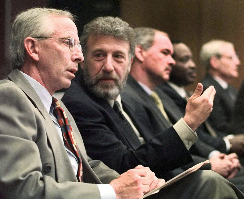 George Zimmer, second from left, has been abruptly dismissed from Men's Wearhouse Inc.