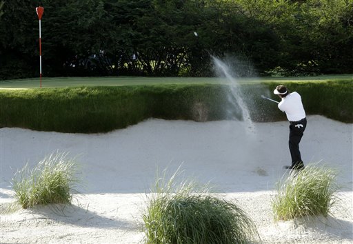 Phil Mickelson hits out of a bunker during the second round of the U.S. Open golf tournament at Merion Golf Club on Friday.