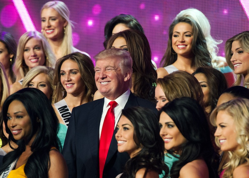 In this photo provided by the Miss Universe Organization, Donald Trump, co-owner of the Miss Universe Organization, poses for a photo with the competitors during rehearsal for the upcoming Miss USA Competition at PH Live in Las Vegas on Saturday, June 15, 2013. (AP Photo/Miss Universe Organization) Miss USA 2013;Rehearsal;Sherri Hill