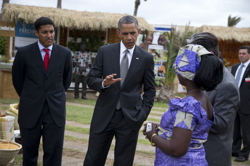 USAID administrator Raj Shah, left, and President Barack Obama talk to Nimna Diayte, president of the Farmers Federation, during a food security expo on Friday in Dakar, Senegal.