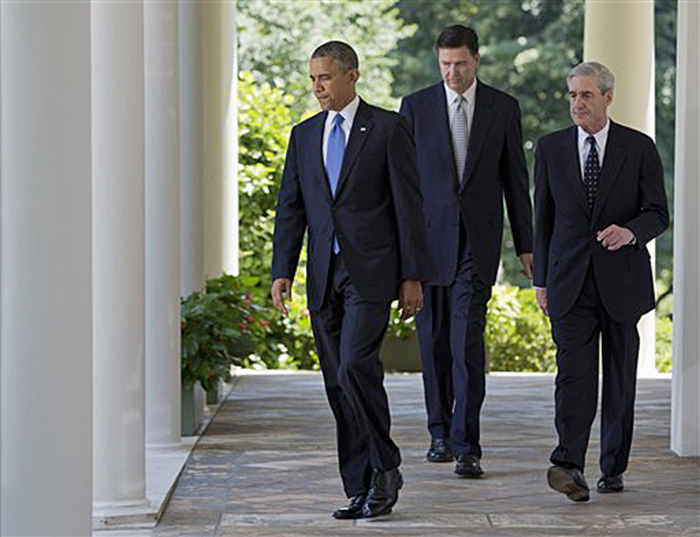 President Obama, outgoing FBI Director Robert Mueller, right, and the nominee to succeed Mueller, James Comey, walk to the Rose Garden, where the president announced Comey's nomination on Friday.