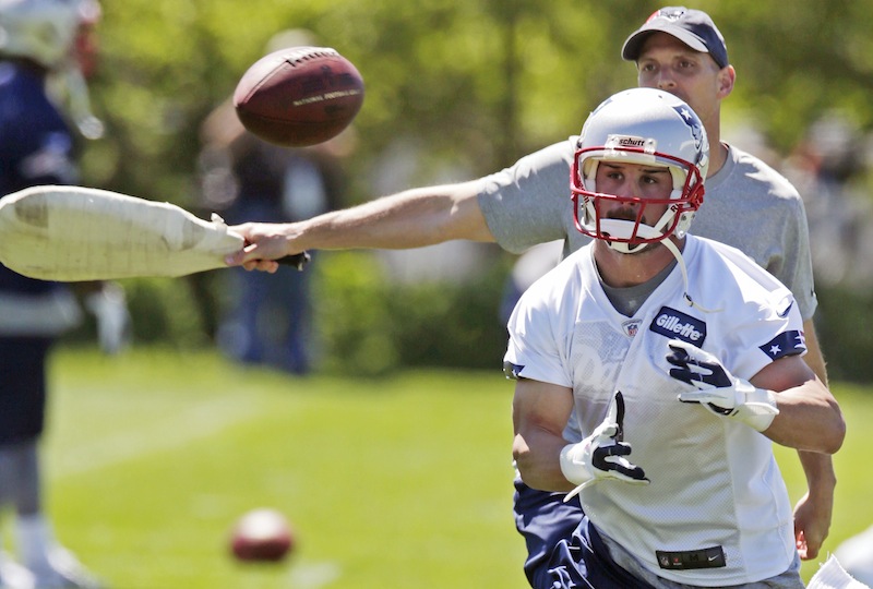 New England Patriots wide receiver Danny Amendola keeps his eyes on the ball on a pass play during NFL football practice in Foxborough, Mass., on Tuesday.