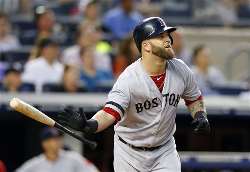 Boston's Mike Napoli watches his grand slam while running toward first base in the third inning of Saturday's game against the New York Yankees at Yankee Stadium in New York. The Red Sox won, 11-1.