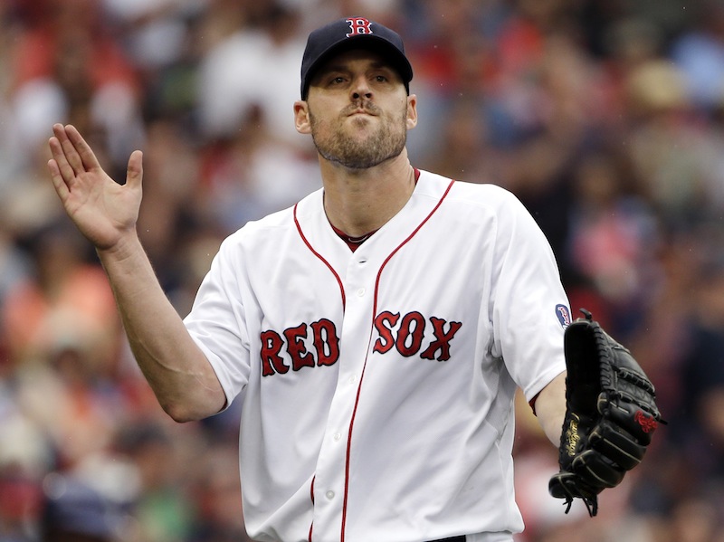 Boston Red Sox starting pitcher John Lackey claps after striking out Colorado Rockies' Tyler Colvin to end the top of the fourth inning of an interleague baseball game at Fenway Park in Boston, Wednesday, June 26, 2013. (AP Photo/Elise Amendola) Fenway Park