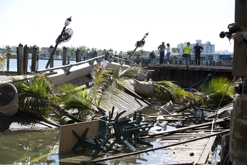 Officials begin their inspection of the outdoor deck that collapsed at Shuckers Bar and Restaurant in North Bay Village, Fla., on Friday.