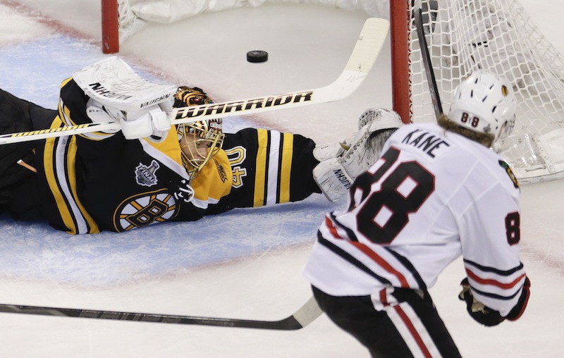 Chicago Blackhawks right wing Patrick Kane (88) scores past Boston Bruins goalie Tuukka Rask (40), of Finland, during the second period in Game 4 of the NHL hockey Stanley Cup Finals, Wednesday, June 19, 2013, in Boston. (AP Photo/Charles Krupa) TD Garden