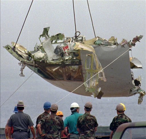 In this Aug. 7, 1996, photo, the cockpit of TWA Flight 800 is lowered at the U.S. Coast Guard station at Shinnecock Inlet in Hampton Bays, N.Y.