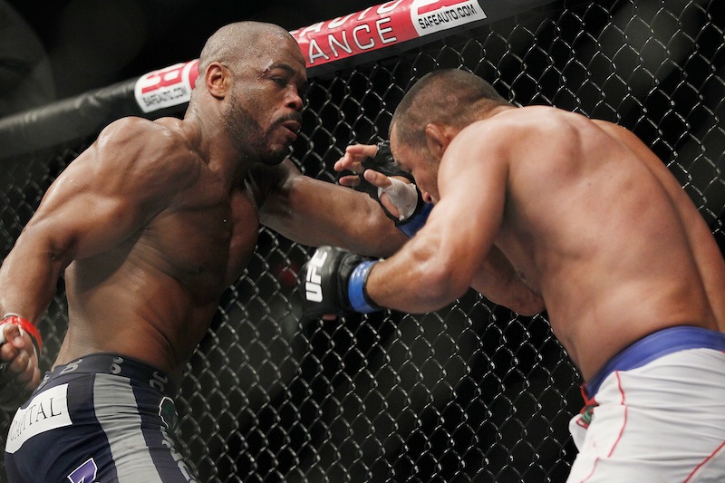 Rashad Evans backs Dan Henderson into a corner during UFC 161 in Winnipeg, Manitoba on Saturday June 15, 2013. Ultimate Fighting Championship is exploring the possibility of bringing a mixed martial arts show to the new 8,000-seat venue in Bangor, Maine, its president said Thursday, June 27, 2013. (AP Photo/The Canadian Press, John Woods) MMA;UFC;161;Winnipeg
