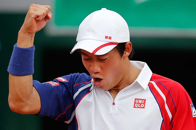 Japan's Kei Nishikori clenches his fist after winning against Benoit Paire of France in their third-round match at the French Open tennis tournament, at Roland Garros stadium in Paris on Saturday. Nishikori won in four sets 6-3, 6-7, 6-4, 6-1.