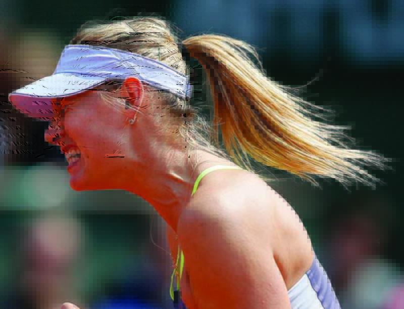 Maria Sharapova reacts shortly before defeating China's Jie Zheng during their third-round match Saturday at the French Open.