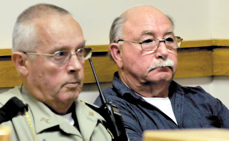 Defendant Horace Barstow, right, sits beside a Somerset County jail transport deputy moments after he was sentenced to four years in prison for unlawful sexual contact of children in Skowhegan District Court on Wednesday.