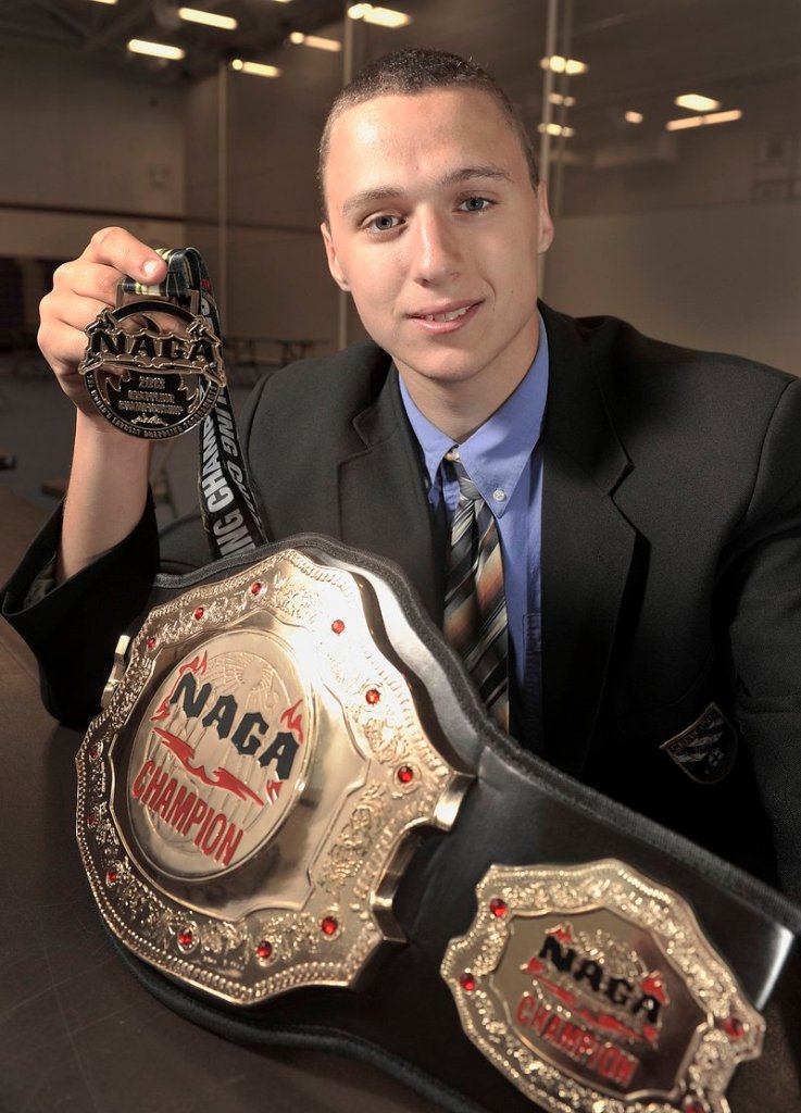 Zordan Holman shows off one of the age-group championship belts he won in April at a Brazilian jiu-jitsu competition in New Jersey.