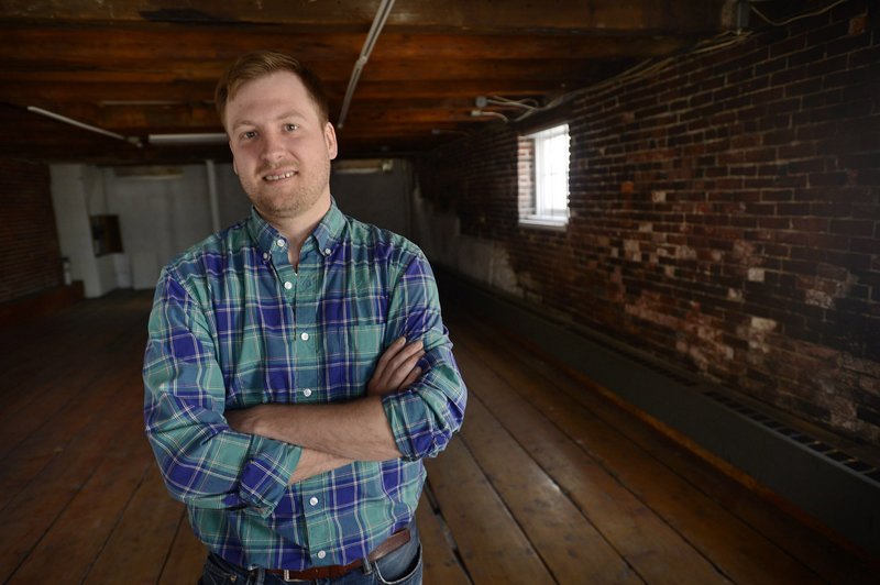 Chef Chris Gould is shown at 414 Fore St. in Portland, where he plans to open a new restaurant. The brick structure was erected in 1828.
