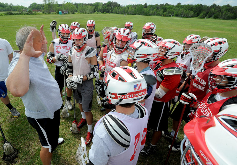 South Portland Coach Tom Fiorini talks to his team at practice on Monday, as the Riots prepare for Tuesday’s playoff game against Gorham – a team the Riots beat in a 12-7 game back on April 17.