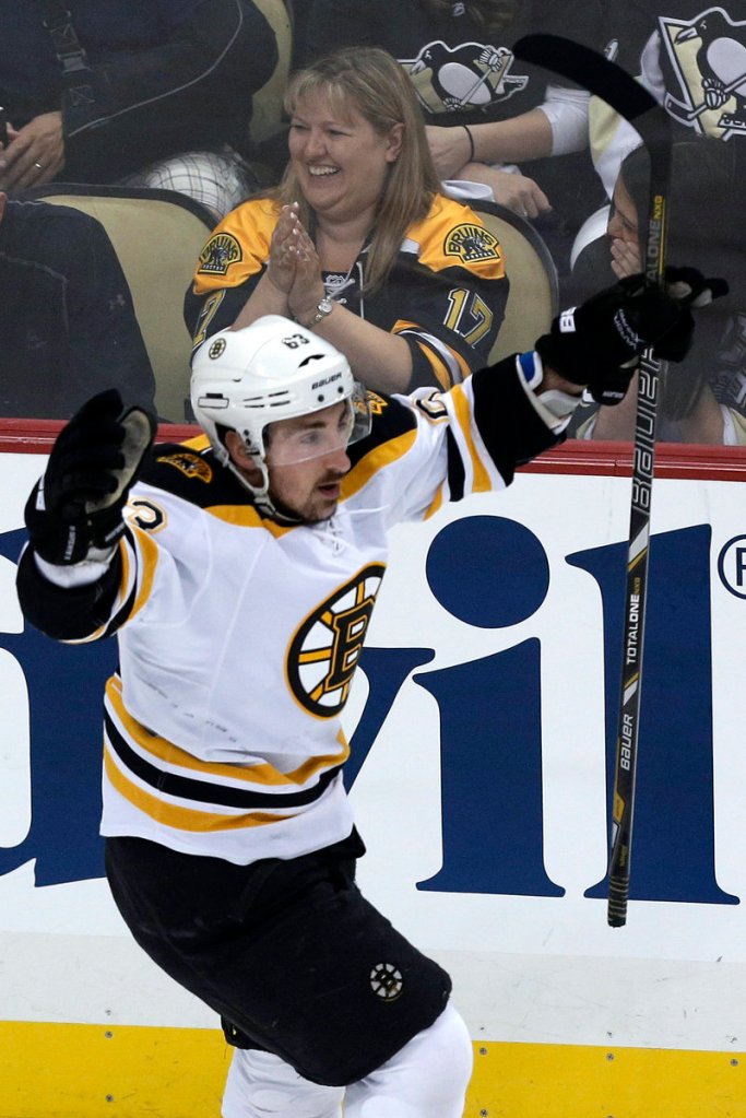 Brad Marchand of the Bruins celebrates his goal 28 seconds into Monday’s game. Marchand added a goal with nine seconds left in the first of Boston’s 6-1 win at Pittsburgh.