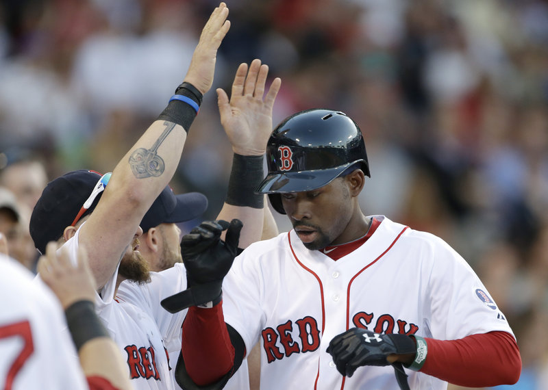 Jackie Bradley Jr. showed a flash of his torrid spring training offense, belting his first major league home run in a 17-5 rout of Texas on Tuesday.