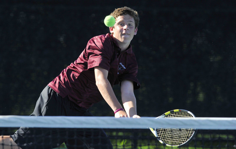 Tom Brent of Gorham lunges to return a shot against Kennebunk’s David Behrens during their No. 3 singles match in the Western Class A final Wednesday at Bates College. Brent won 7-6 (5), 6-4, helping Gorham to a 4-1 victory.