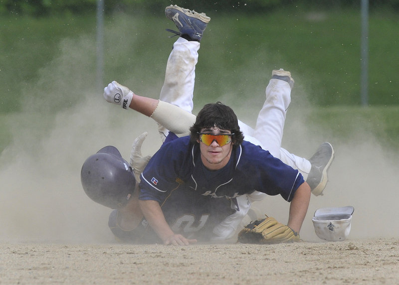 Westbrook shortstop Collin Joyce watches his throw to first, completing a double play Thursday after forcing Liam Fitzpatrick of Cheverus in the third inning. Westbrook rallied at home for a 3-2 win in a Western Class A quarterfinal.