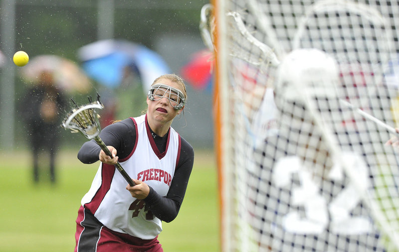 Dayze Gaulin of Freeport unloads a shot on goal during Yarmouth's 12-10 victory. Yarmouth will be home against Morse in the regional championship game Wednesday.
