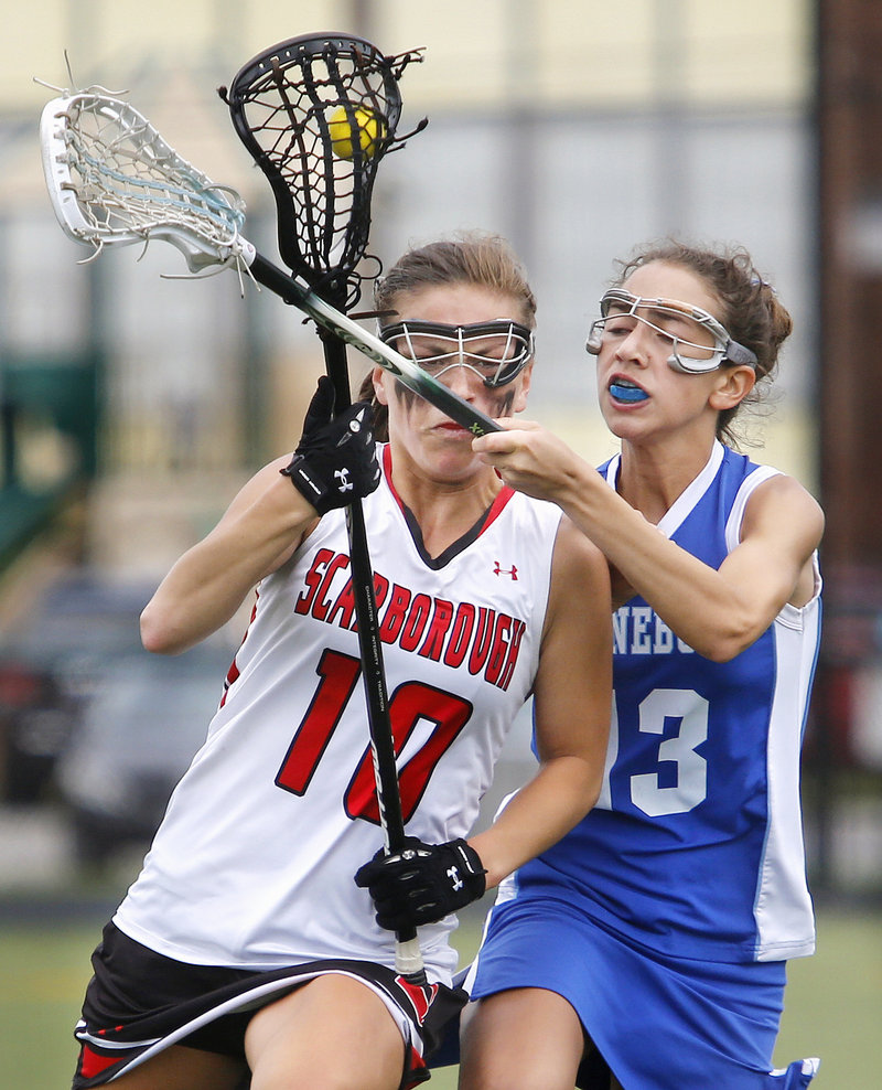 Sophie Joseph of Kennebunk plays close defense on Jessica Meader of Scarborough during the second half of Kennebunk's 9-7 victory Saturday.