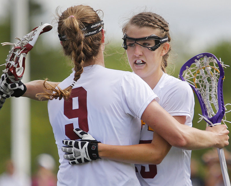 Talley Perkins, right, celebrates with teammate Lauren Steidl after scoring one of her three goals Saturday for Cape Elizabeth in a 17-10 girls' lacrosse victory. The Capers will play top-seeded Waynflete for the regional title Wednesday.