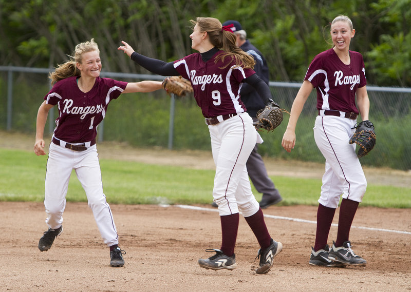 A double play is a pitcher’s best friend, and also time to celebrate as Greely second baseman Alexa Faietta, left, and pitcher Dani Cimino do so in the fifth inning Wednesday as first baseman Mykaela Twitchell looks on.