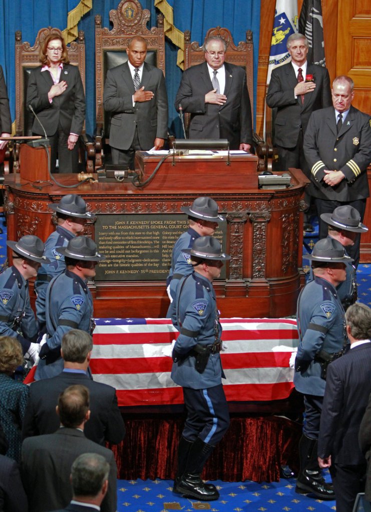 Pallbearers bring in Cellucci's casket for the memorial service Thursday in Boston.
