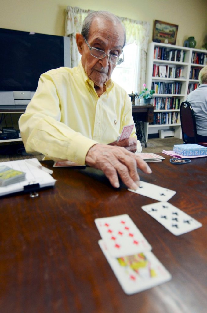 Joe Tuzzo, 104, plays bridge at the Claire Teague Senior Center in Great Barrington, Mass. Tuzzo describes himself as a formidable bridge player, but he is known as the man to beat as a wordsmith.