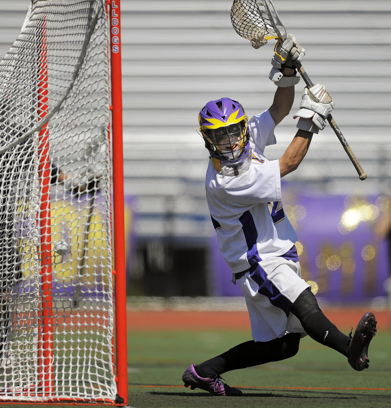 Cheverus goalie James Biegel watches as a shot zips past him and into the net during the second half of Scarborough’s 15-4 victory.