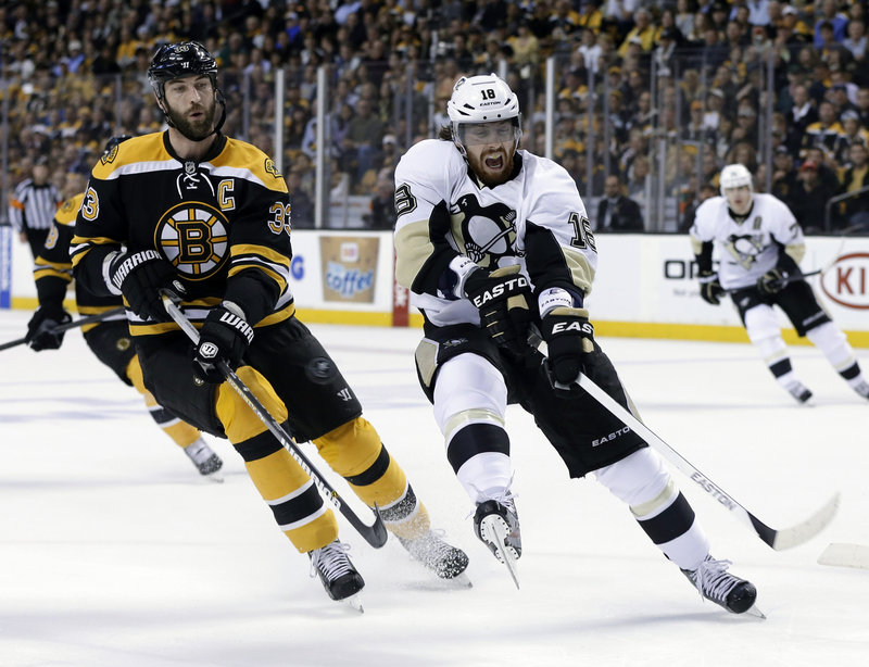 Zdeno Chara, shown matching Pittsburgh’s James Neal stride for stride, might be the NHL’s most physically intimidating defenseman, standing 6-foot-9.