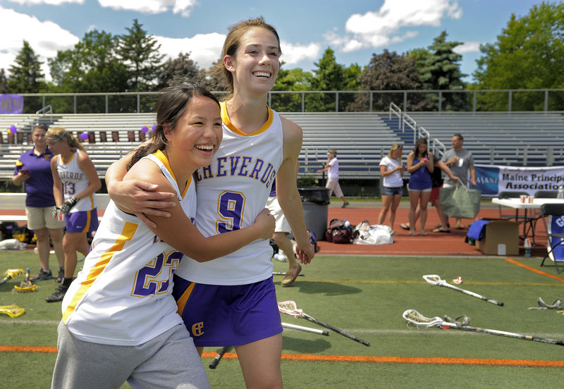 Hope Correia, left, and Meredith Willard embrace after Cheverus edged Massabesic 8-7 Saturday at Fitzpatrick Stadium for the Stags’ first Class A girls’ lacrosse state title.