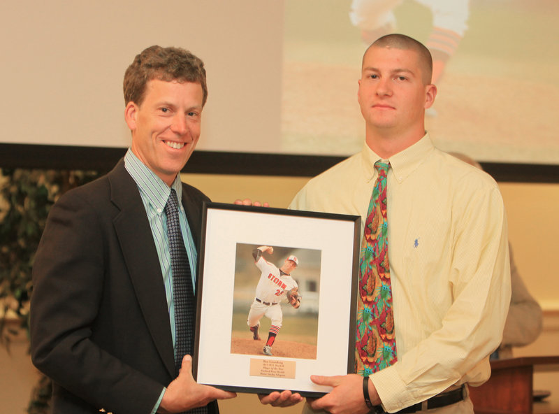 Scarborough's Ben Greenberg, the baseball player of the year, receives his framed photo from sports writer Glenn Jordan.