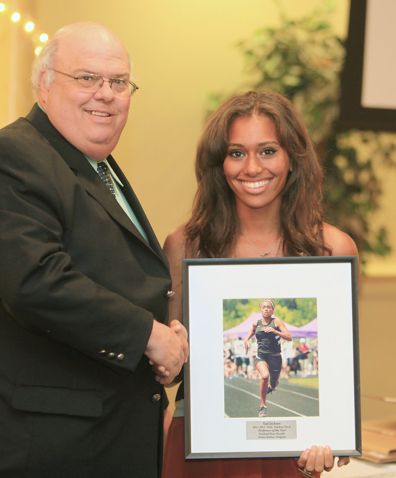 Brewer's Teal Jackson, with sports writer Paul Betit, was chosen as the top athlete for girls' outdoor track after winning four individual events at the Class A state meet.