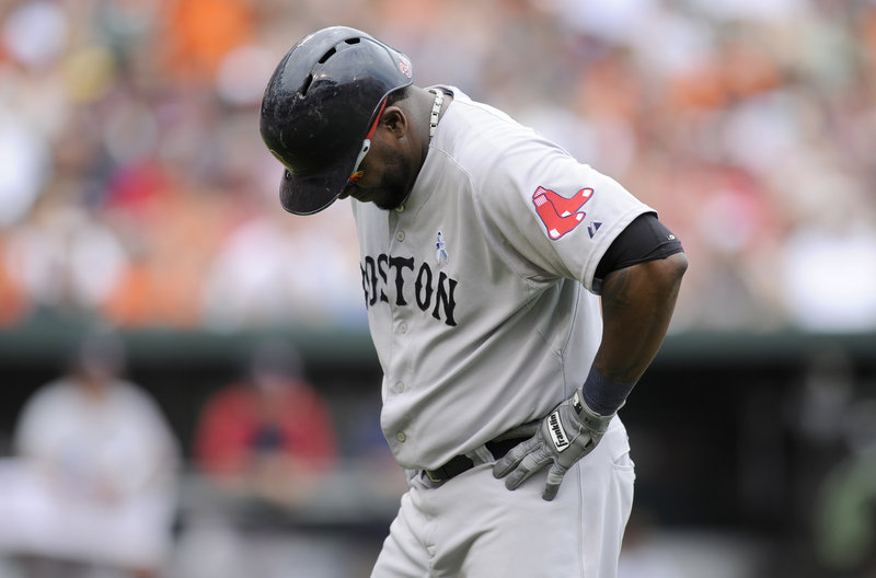 Red Sox designated hitter David Ortiz hangs his head after lining out to right field in the eighth inning of Boston’s 6-3 loss to the Orioles at Baltimore on Sunday. Ortiz was 0 for 4.