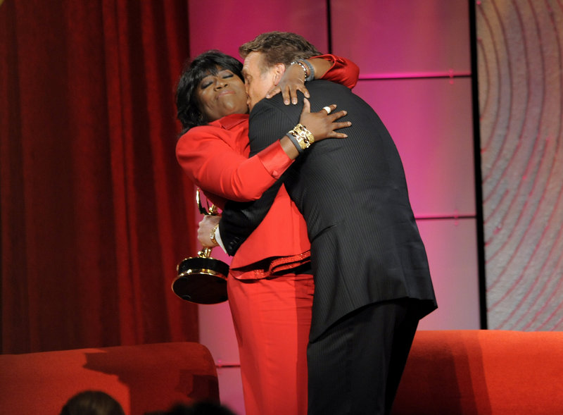 Sheryl Underwood hugs Doug Davidson, winner of the award for outstanding lead actor in a drama series for “The Young and the Restless.”