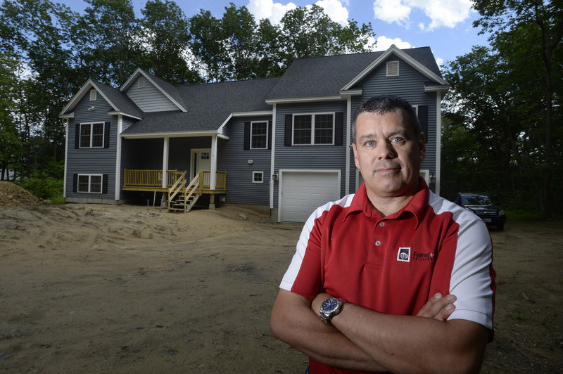 Larry Duell of Father and Son Builders, Inc. in front of a home the company recently built on Captain Thomas Road in Ogunquit on Monday, June 17, 2013. For the first time in seven years, most U.S. homebuilders are optimistic about home sales.