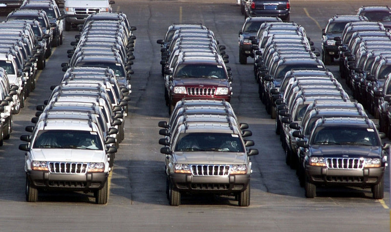 Chrysler has agreed to recall 2.7 million older-model Grand Cherokees, like these outside a plant in Detroit, and Libertys to fix fuel tanks that could cause fires in rear-end crashes.