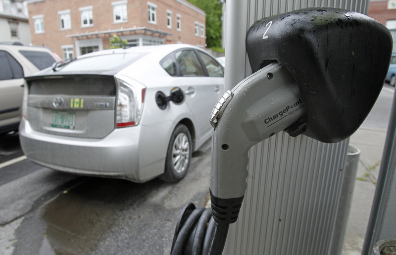 An electric charging station is seen on Tuesday, June 18, 2013 in Montpelier, Vt. Vermont Gov. Peter Shumlin and Quebec Premier Pauline Marois say they're implementing an electric vehicle charging corridor across the international boundary between the state and province. The corridor will initially link Burlington and Montreal with more than 20 charging stations along the 138-mile route. (AP Photo/Toby Talbot)