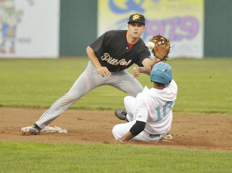 John Kinne of the Pittsfield Suns takes the late throw as Aaron Wilson of the Old Orchard Beach Raging Tide steals second base in the second inning.