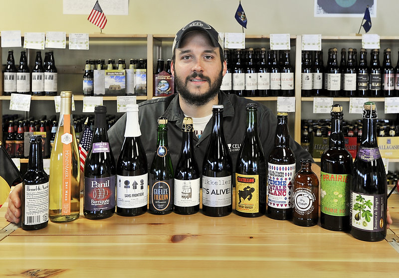 Greg Norton, owner of Bier Cellar at 299 Forest Ave., displays a large variety of beers, plus a mead and hard cider, that will be featured this weekend during The Festival at The Portland Company on Fore Street.