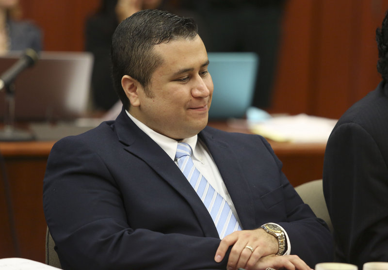 George Zimmerman smiles as attorney Mark O’Mara questions potential jurors Thursday. Zimmerman is charged with second-degree murder for shooting Trayvon Martin.