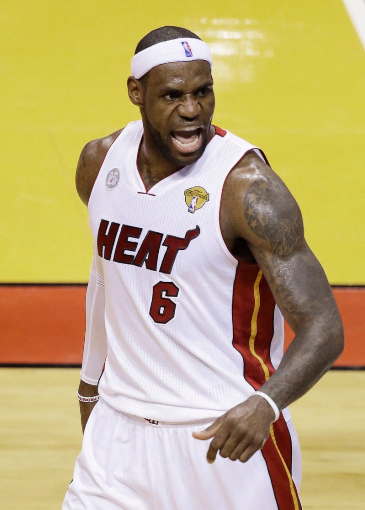 LeBron James remains at the top of the basketball world, coming up big in the biggest of games Thursday night as the Miami Heat remained the NBA champions by defeating the San Antonio Spurs.