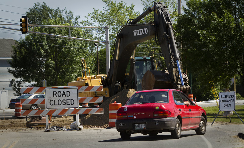 A motorist drives near Dustan Corner on Friday, June 21, 2103. Work on the new Payne Road-Route 1 intersection will switch to nighttime hours because the work has snarled traffic along busy Route 1 in the past week.