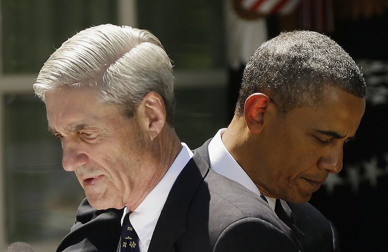 President Obama and outgoing FBI Director Robert Mueller are seen Friday in the Rose Garden of the White House in Washington, where the president announced he would nominate James Comey to replace Mueller as FBI director.