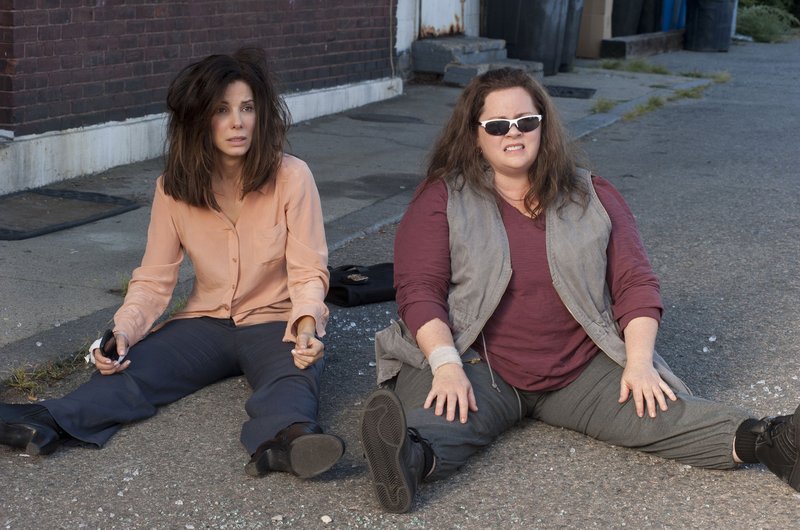 Sandra Bullock, left, and Melissa McCarthy star as a rumpled FBI agent and a gruff Boston cop, respectively, in “The Heat.”