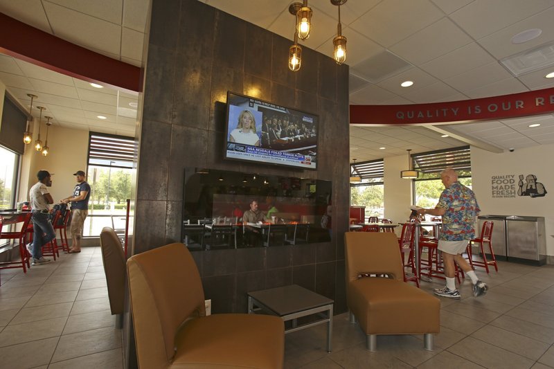 The Wendy’s on Millenia Boulevard in Orlando, Fla., hopes to attract a broader customer base by adding flat-screen televisions and a fireplace to the interior of their restaurant.
